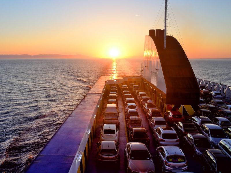 Luxury cars transport truck on road